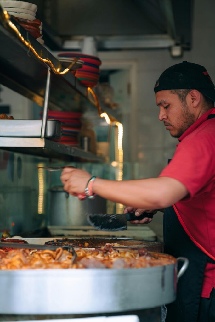 Side View of a Chef Cooking in a Restaurant